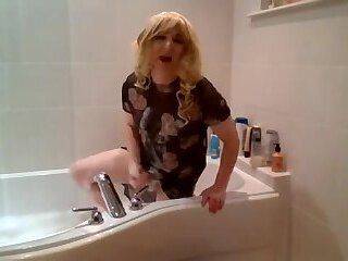 Taking a bath in a black see-through dress and no panties - ashemaletube.com